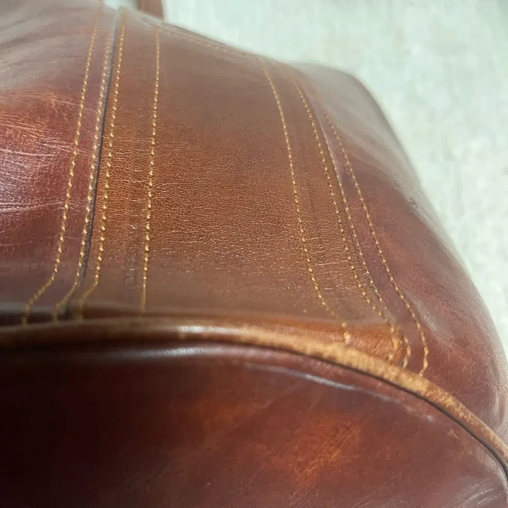 Fortune Duck vintage leather Brown sling back bucket style bag.